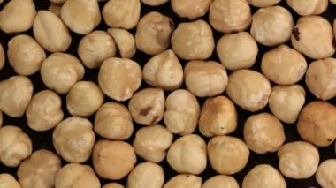 Market video ekran koruyucu, fındık çekirdekleri makro yakın çekim üst görünüm arkaplan döndürme