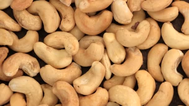 Kruidenier Video Screensaver Roterende Achtergrond Van Geroosterde Cashewnoten Close Top — Stockvideo