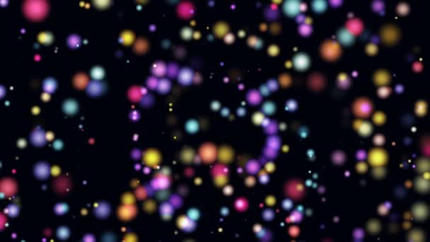 Beaucoup de particules mobiles multicolores de différentes tailles dans l'espace sur un ordinateur d'arrière-plan noir 3D rendant économiseur d'écran de clip vidéo 4k 