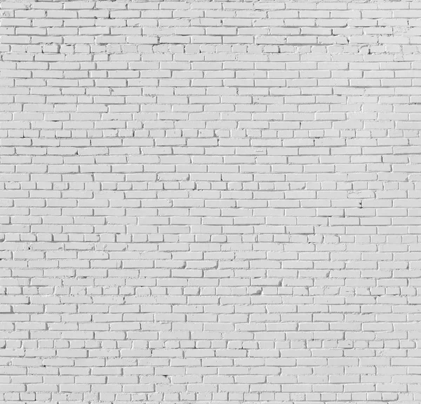 Mur en brique peint avec de la peinture blanche. — Photo