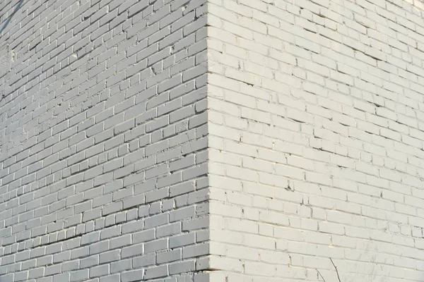 Mur en brique peint avec de la peinture blanche. — Photo