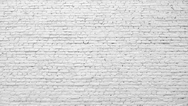 Beyaz boyayla boyanmış tuğla duvar.