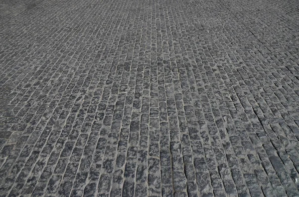 Old cobblestone pavement close-up. — Stock Photo, Image