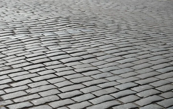 Old cobblestone pavement close-up. — Stock Photo, Image