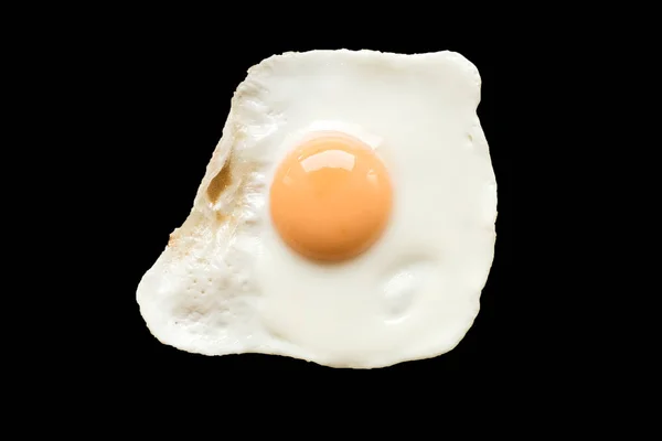 Fried egg on black background — Stock Photo, Image