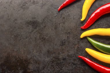 chilli peppers on rusty metal background