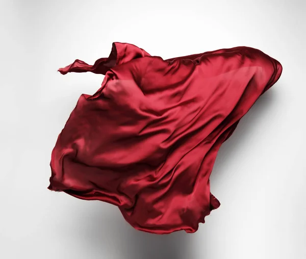 Красная ткань в движении — стоковое фото