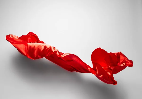 Abstract red fabric in motion — Stock Photo, Image