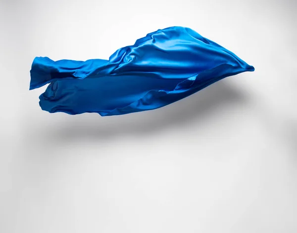 Abstrakter blauer Stoff in Bewegung — Stockfoto