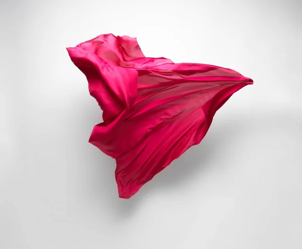 Tecido vermelho abstrato em movimento — Fotografia de Stock