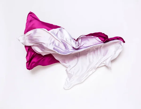 Абстрактные розовые и белые ткани в движении — стоковое фото