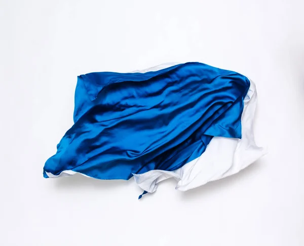 Abstrakter blauer und weißer Stoff in Bewegung — Stockfoto