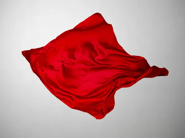 Abstract red fabric in motion — Stock Photo, Image