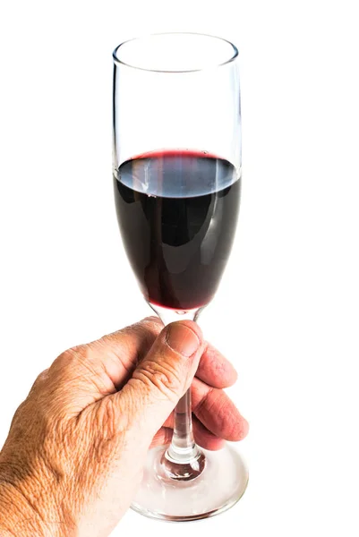 Mão segurando um copo de vinho tinto — Fotografia de Stock