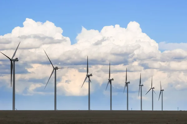 Wind Generators Silhouetted in the Evening under beautiful clouds — Stock Photo, Image