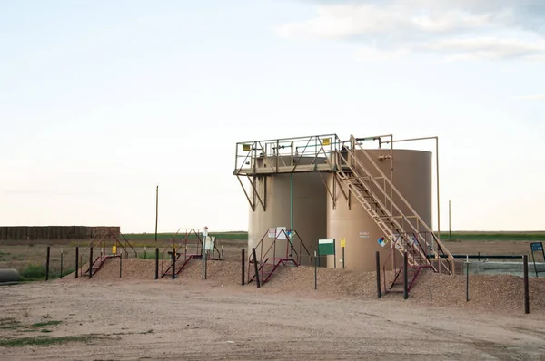 Two tanks used to store crude oil after it is pumped from the ground. — ストック写真