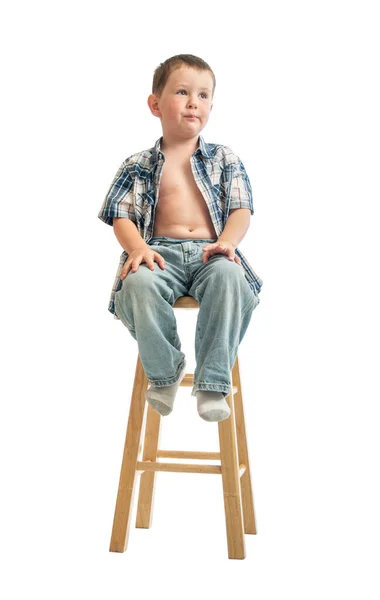 Nervous little boy waits for a Doctor at the local clinic. — Stock Photo, Image