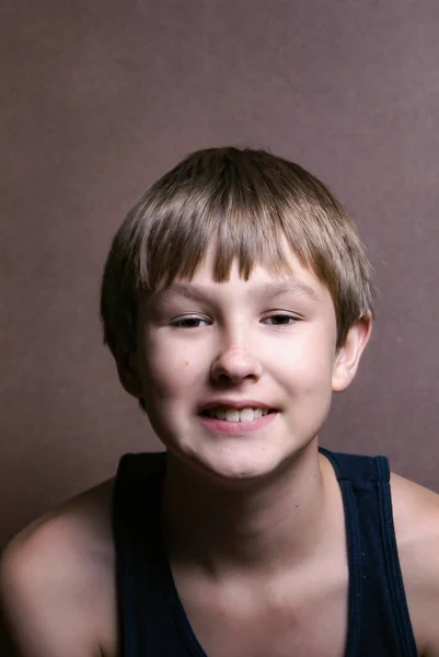 Cute young pre-teen boy smiling at the camera — ストック写真