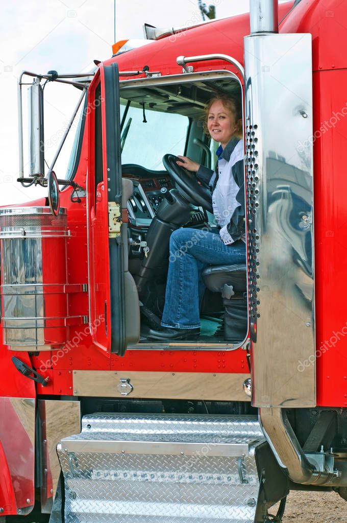 Interior View Of Big Rig With Woman Truck Driver