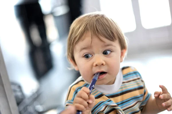 Little Boy Looking Sideways Pensive Pen Mouth — Stock Photo, Image