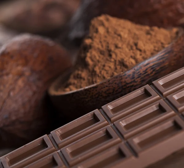 Chocolate bars, cacao beans and powder