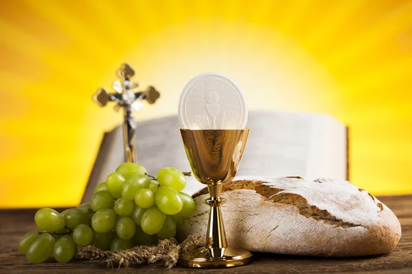 Symbol of christian religion and a golden chalice — Stock Photo, Image