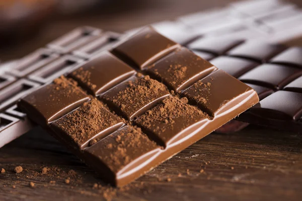 Chocolate bars with powder — Stock Photo, Image