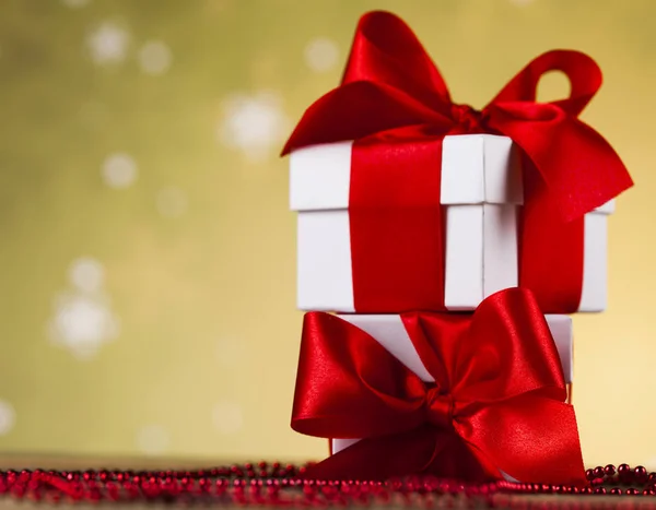 Gift boxes with red ribbon — Stock Photo, Image