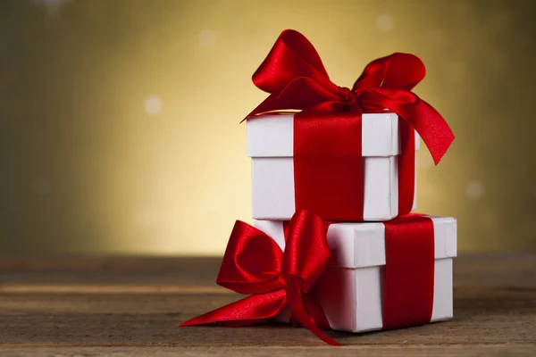 Presents with red ribbon — Stock Photo, Image