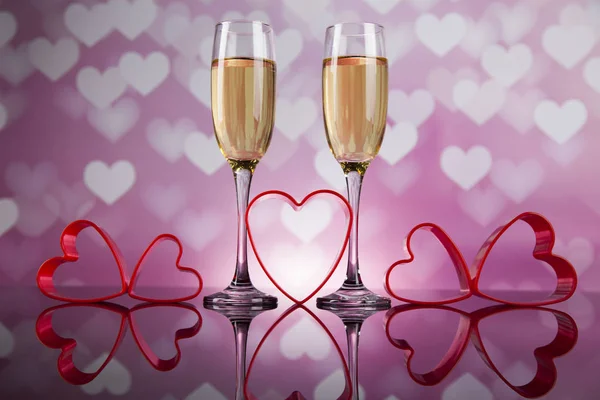 Celebration with champagne and hearts — Stock Photo, Image