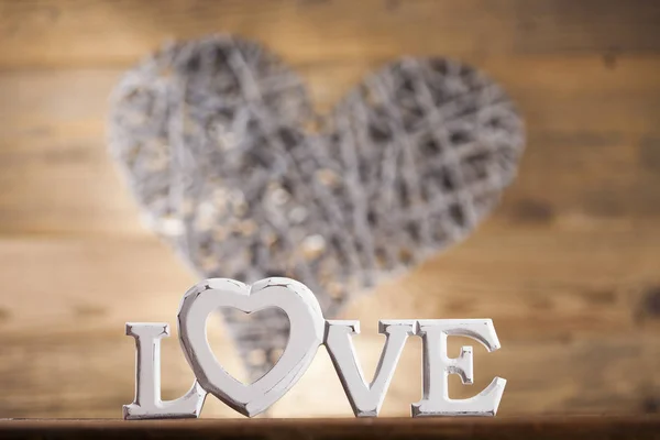 Wooden letters love and heart