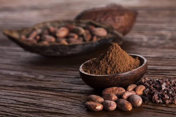 Cocoa pod on wooden background — Stock Photo, Image