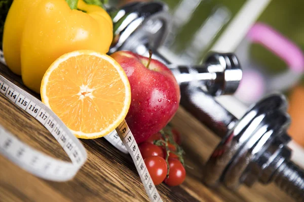 Dumbbells and fresh fruits — Stock Photo, Image