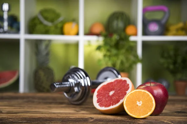 Dumbbells and fresh fruits — Stock Photo, Image