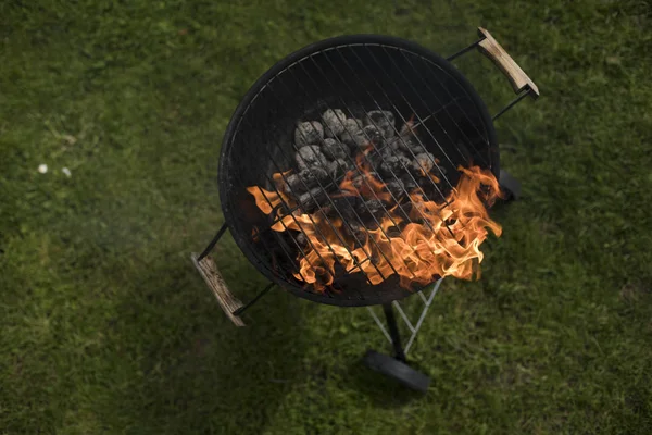 Barbecue grill with fire on nature — Stock Photo, Image