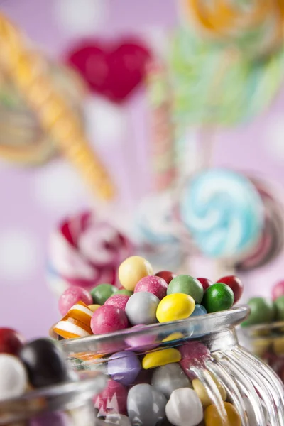 Colorful lollipops and different candies — Stock Photo, Image