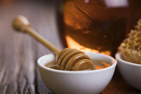 Fresh honey on wooden table — Stock Photo, Image