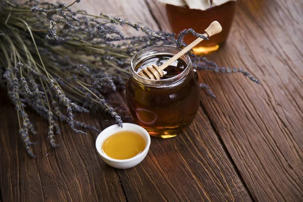 Fresh honey on wooden table — Stock Photo, Image