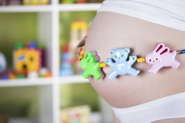 Embarazada, juguete del bebé — Foto de Stock