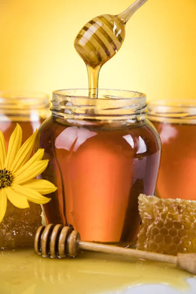 Fresh honey on wooden table — Stock Photo, Image