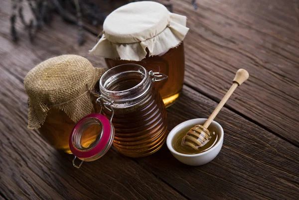 Fresh honey on wooden table — Stock Photo, Image