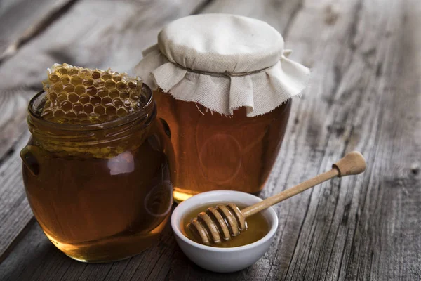 Fresh honey on wooden table — Stock Photo, Image