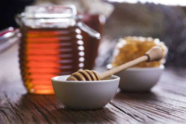 Fresh honey on wooden table — Stock Photo, Image