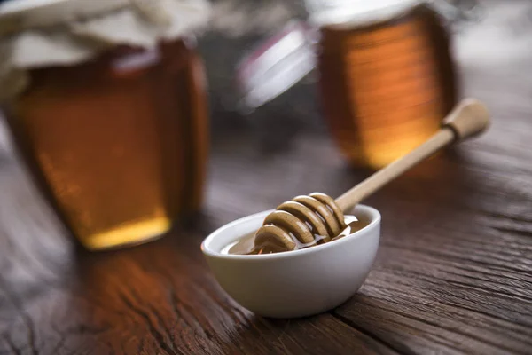 Fresh honey on wooden table — Stock Photo, Image