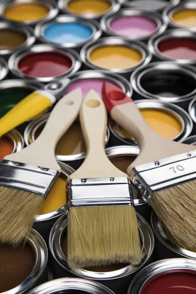 Paintbrush on cans with color — Stock Photo, Image