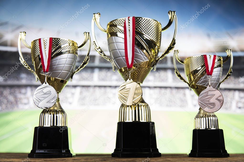Award winning and championship concept, trophy cup on sport background