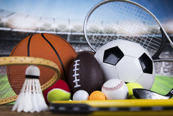 Sport equipment and balls, stadium background 