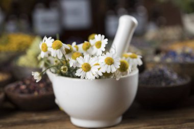 Natural remedy,Herbal medicine and wooden table background clipart