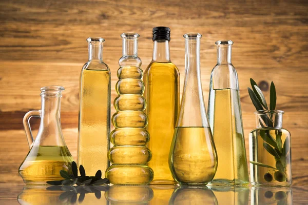 Cooking olive oils, bottles background — Stock Photo, Image
