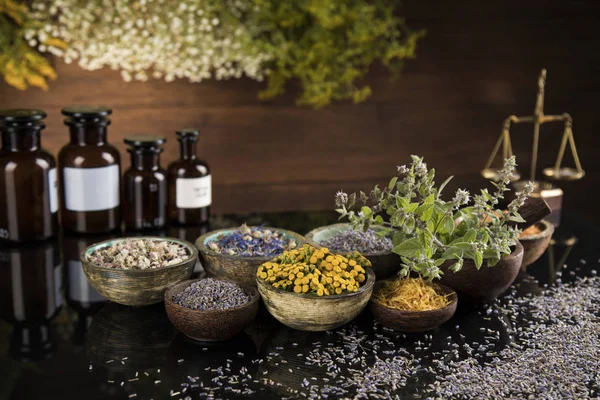 Natural medicine in black mirror background — Stock Photo, Image